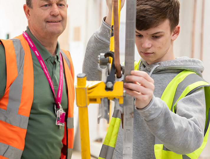 Students working in the plumbing workshop