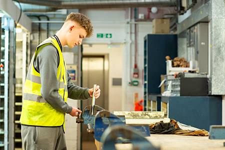 Student working in the electrical workshop