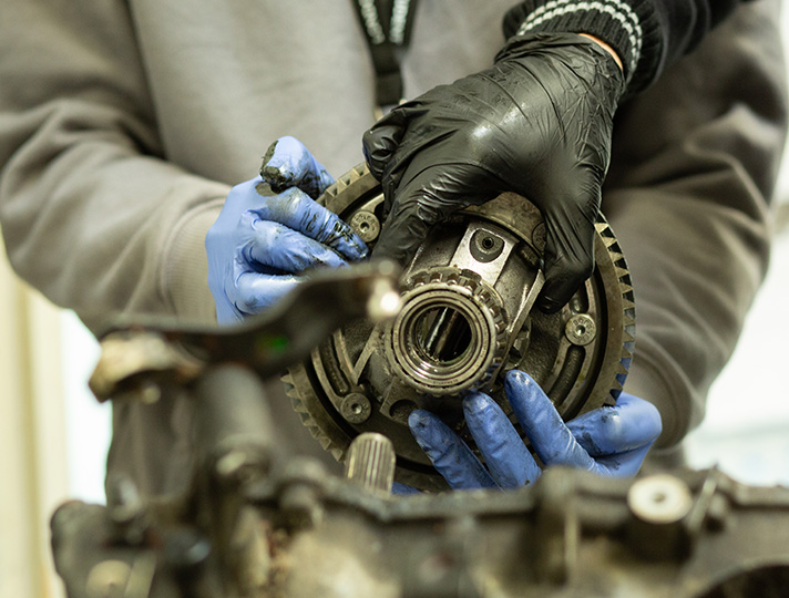 Student learning the car parts